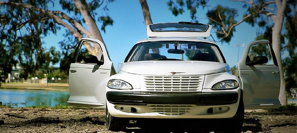 White car with open doors