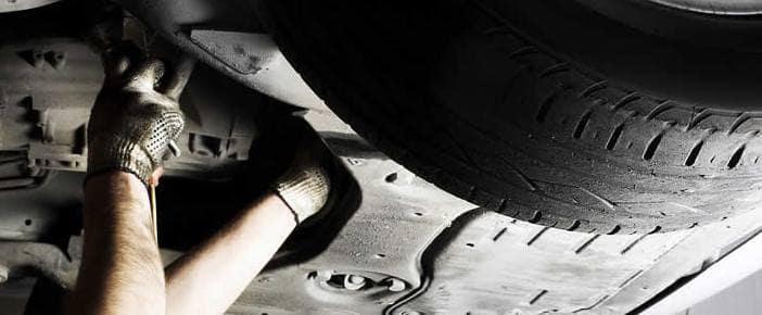 A person working under chassis